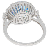 Sterling silver ring featuring a round blue topaz gemstone from the back, showcasing intricate design details.